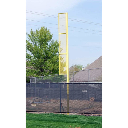 Pair of 30-foot tall galvanized steel foul poles with bright orange finish, designed for permanent inground stadium installat